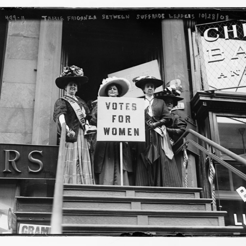 Suffragists with signs: "Votes for Women"